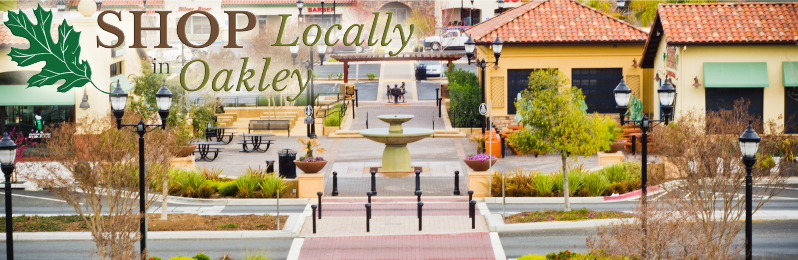 Photo of Main Street  and Oakley Plaza showing Mr. Pickles and La Costa, text on photo  reads  Shop Locally in Oakley