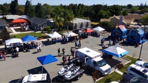 Photo of booths and visitors at child safety day.